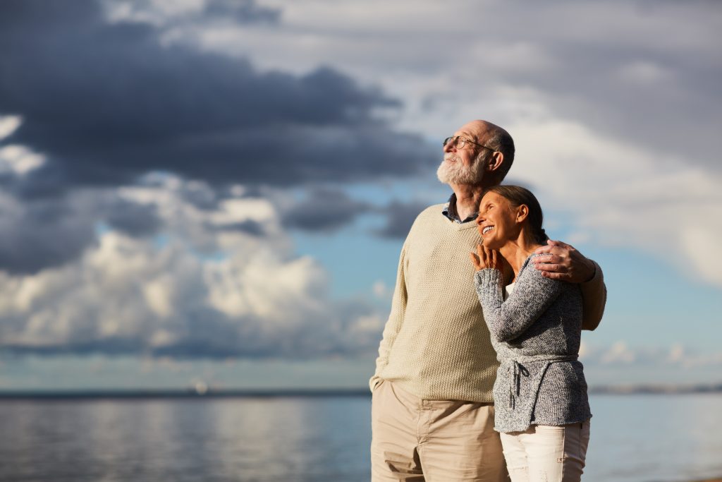 Couple enjoying the sunset at the beach.